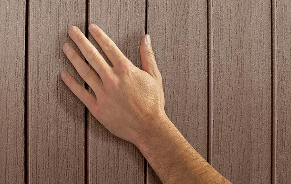 Hand touching a wooden surface