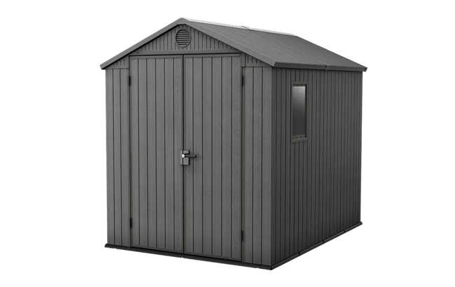 Gray storage shed with a small window on a green background